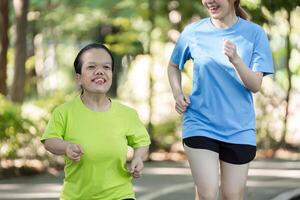 Young Woman with Physical Differences Exercising with Friend in Park, Embracing Fitness and Friendship in an Inclusive Environment photo