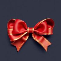 Red bow with gold ribbon on dark background photo
