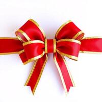A red and gold bow on a white background photo