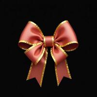 A red bow with gold trim on a black background photo