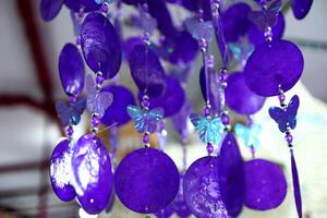 Handmade souvenir decorated with different sea shells photo
