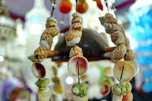 Handmade souvenir decorated with different sea shells photo
