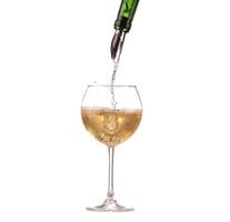 poured white wine on a white background photo