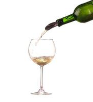 poured white wine on a white background photo