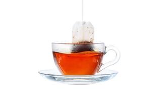 Glass of Tea with Bag End. Isolated on white background, with clipping path photo