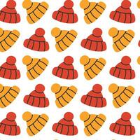 Seamless pattern of red and yellow winter hats on a white background in a flat design style. vector