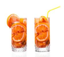 pitcher with a refreshing drink with lemon slices of orange and kiwi on white background photo