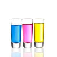 Shots - Three colourful shot drinks on a white background with reflections photo