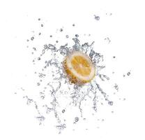 segment of lemon falling in to the water and making splash photo