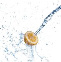 segment of lemon falling in to the water and making splash photo
