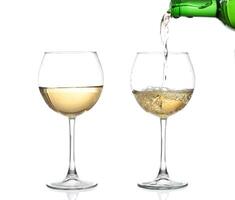 WHITE wine swirling in a goblet wine glass, isolated on a white background photo