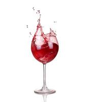 Wine collection - Splashing red wine in a glass. Isolated on white background photo