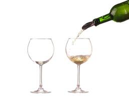 poured white wine on a white background photo