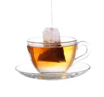 Glass of Tea with Bag End. Isolated on white background, with clipping path photo