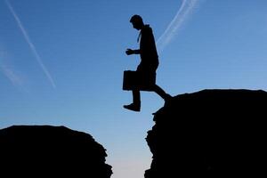 man at the top of the mountain photo