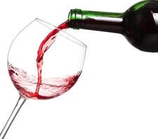 Red wine pouring on white background photo