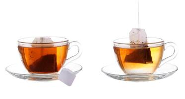 Set of cups with tea isolated on white background. photo