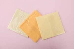 Top View Three Color Square Sliced Cheese with Plastic Individual Package photo