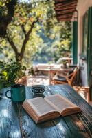 A cozy evening with a book and drink overlooking Pragues historic skyline at sunset photo