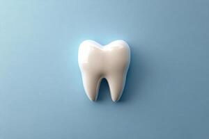 A realistic tooth model on a blue background highlighting dental health and hygiene importance photo