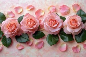 Soft pink roses arranged with petals on a light pink surface for a romantic occasion photo