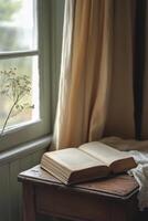 A cozy reading experience with an open book on a knit blanket near warm lights in the evening photo