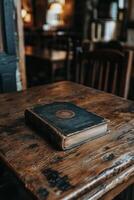 A vintage book resting on a wooden stump in a softly lit interior setting during daylight photo