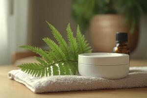 Natural skincare setup with cream, fern leaves, and essential oil on a wooden table in soft light photo