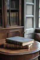 An antique book resting on a wooden table in a lush forest during sunset light photo