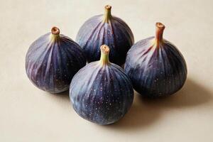 Three ripe figs arranged neatly on a simple background highlighting their color and texture photo