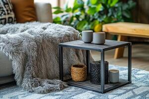 Cozy living space with three coffee cups on a small table surrounded by soft blankets and plants photo