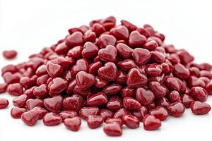 Red heart shaped candies scattered on a surface create a festive atmosphere for celebrations photo