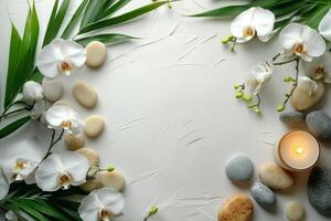 A serene arrangement of orchids, stones, and a candle on a textured surface in a tranquil setting photo