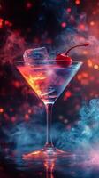 A vibrant cocktail with ice and a cherry surrounded by colorful smoke effects at night photo