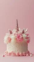 A whimsical unicorn sculpture made of cotton candy towers against a blue sky with fluffy clouds photo