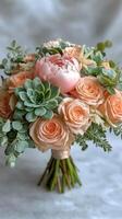 Beautiful arrangement of peach roses with greenery and berries in a soft light setting photo