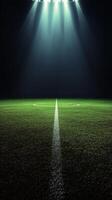 A foggy sports field with bright lights and a central line during an evening event photo
