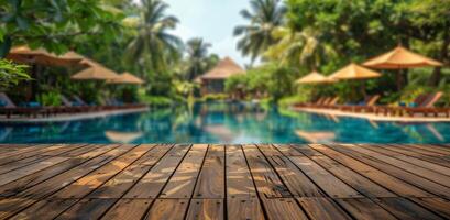 Wooden Deck Overlooking a Tropical Resort Pool photo