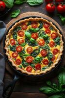 Fresh vegetable quiche with spinach and cherry tomatoes on a rustic wooden table photo