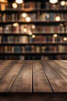 Warm wooden table in a quiet library with shelves full of books at evening time photo