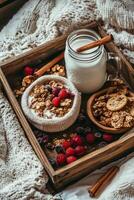 Delicious breakfast tray with granola, berries, and milk in a cozy setting photo