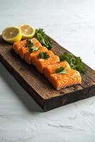 Fresh salmon fillets seasoned with herbs and citrus on a wooden board for cooking preparation photo