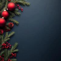 Decorative Christmas elements with red ornaments and pine branches on a dark background photo