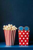 Colorful popcorn containers with playful designs on a blue background photo