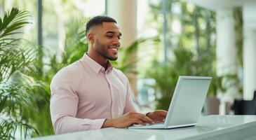 Hotel receptionist working at the front desk during daytime with natural light and plants photo