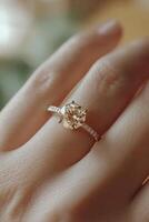 Elegant diamond ring adorning a hand with soft background bokeh effect photo
