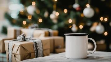 Cozy mug beside wrapped gifts and a decorated Christmas tree with glowing lights photo