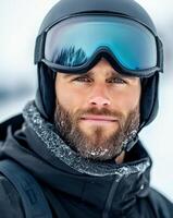 Male skier with goggles and helmet enjoying winter sport in snowy mountain landscape photo