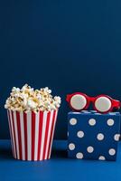 Colorful popcorn containers with playful designs on a blue background photo