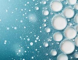 Soft cream with water droplets on a blue background for skincare products display photo